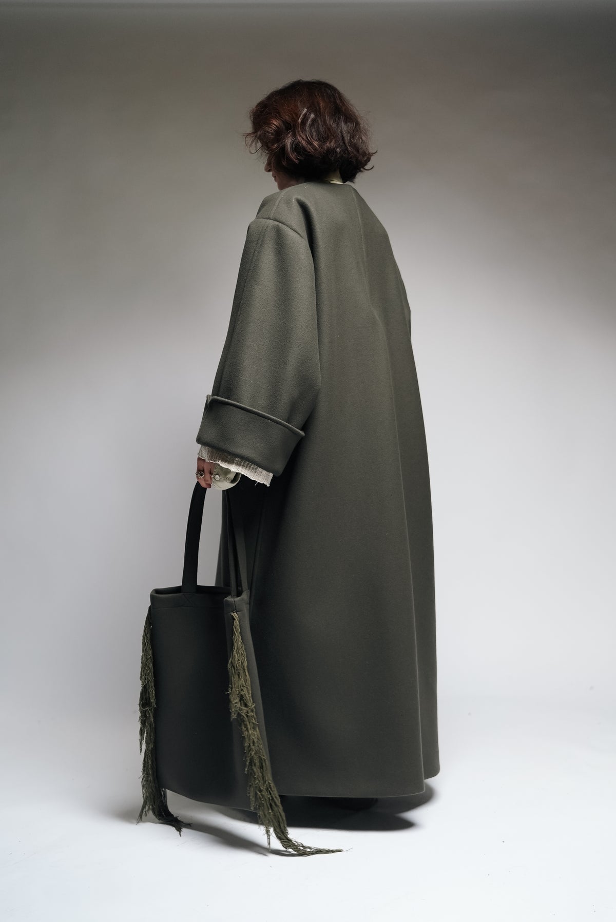 Between Worlds. The coat.