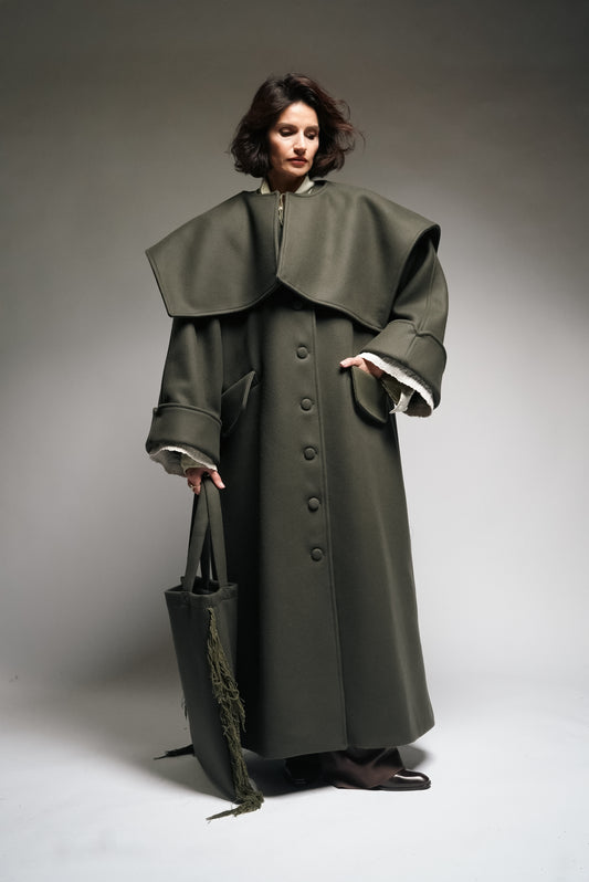 Between Worlds. The coat.