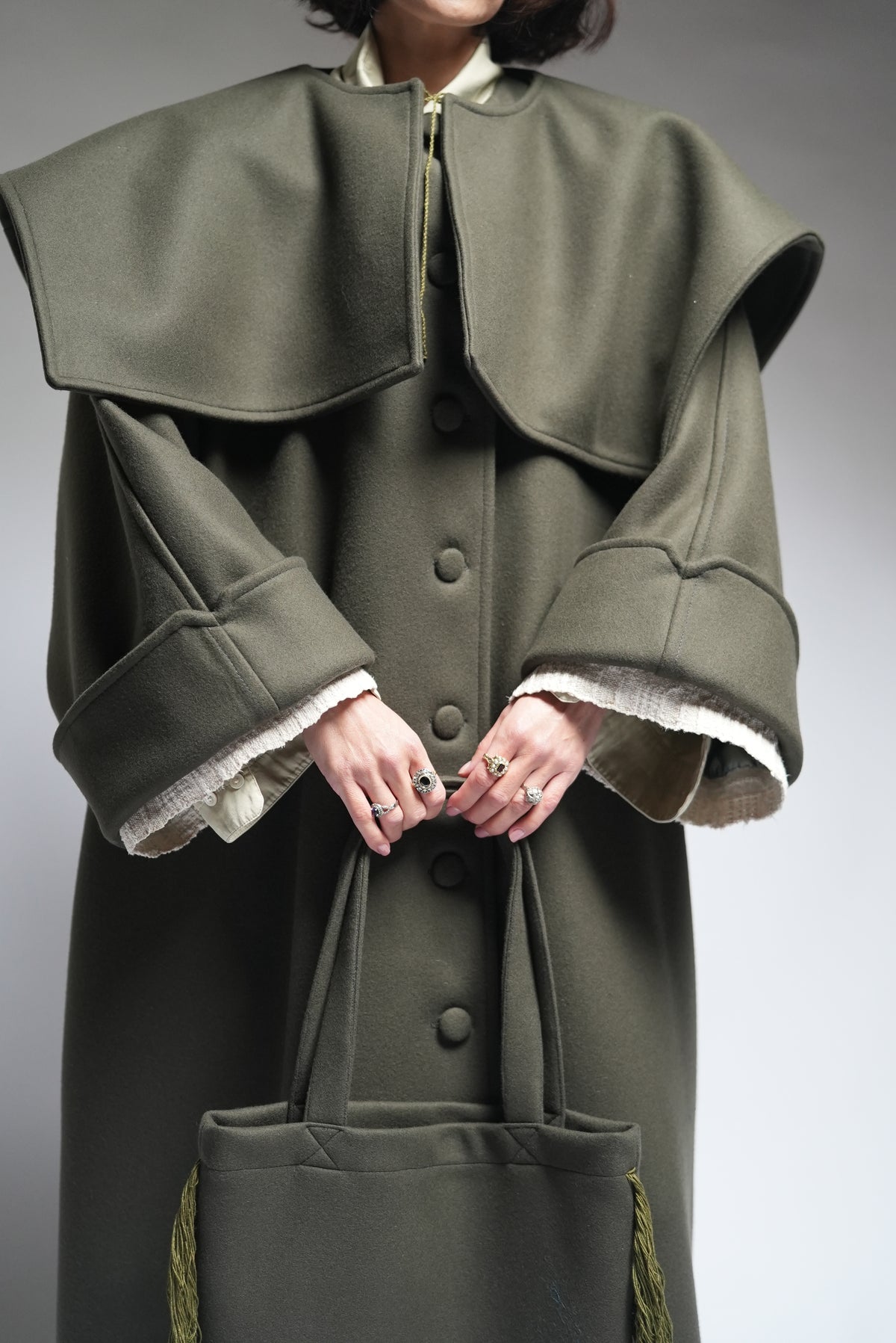 Between Worlds. The coat.