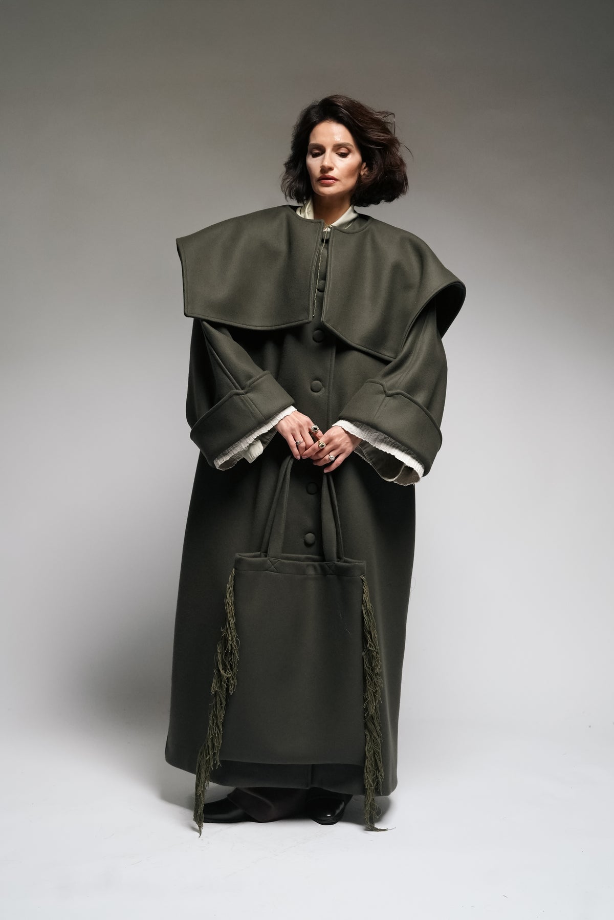 Between Worlds. The coat.