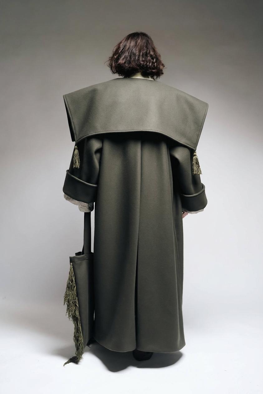 Between Worlds. The coat.