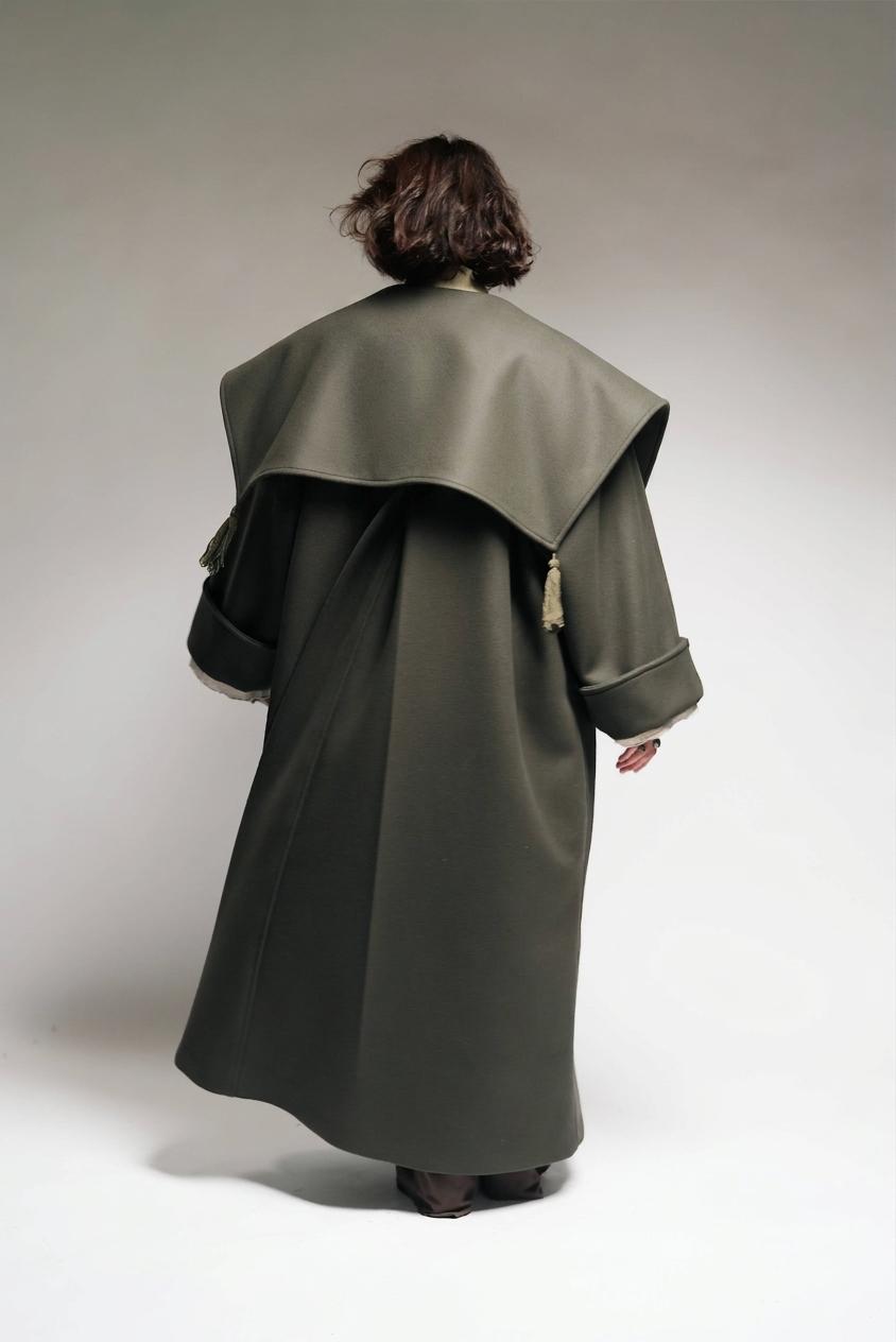Between Worlds. The coat.