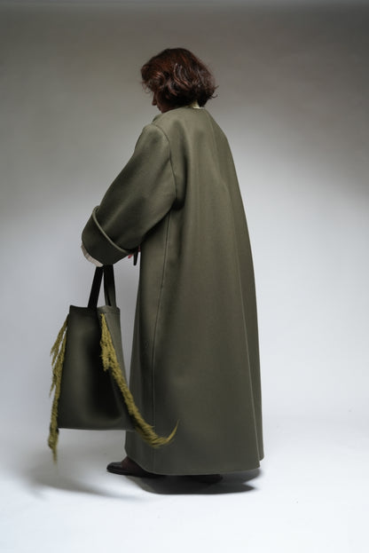 Between Worlds. The coat.