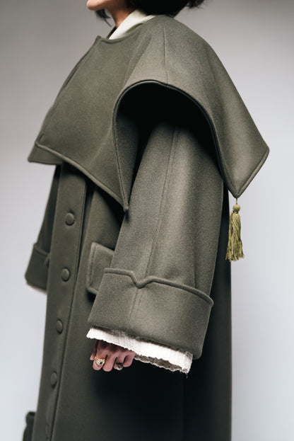 Between Worlds. The coat.