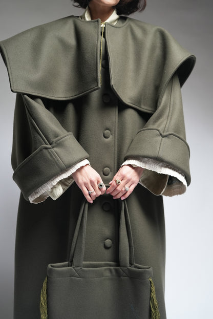 Between Worlds. The coat.