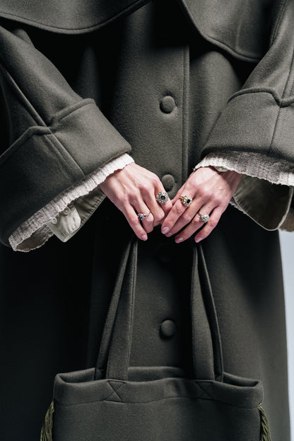 Between Worlds. The coat.