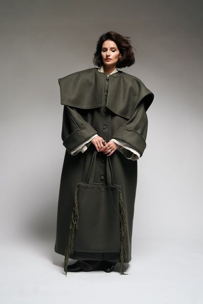 Between Worlds. The coat.