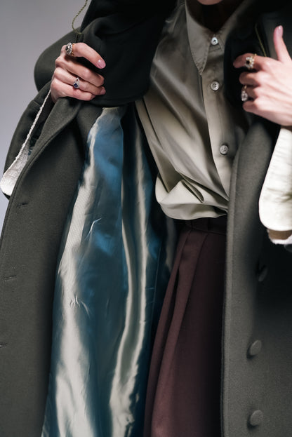 Between Worlds. The coat.