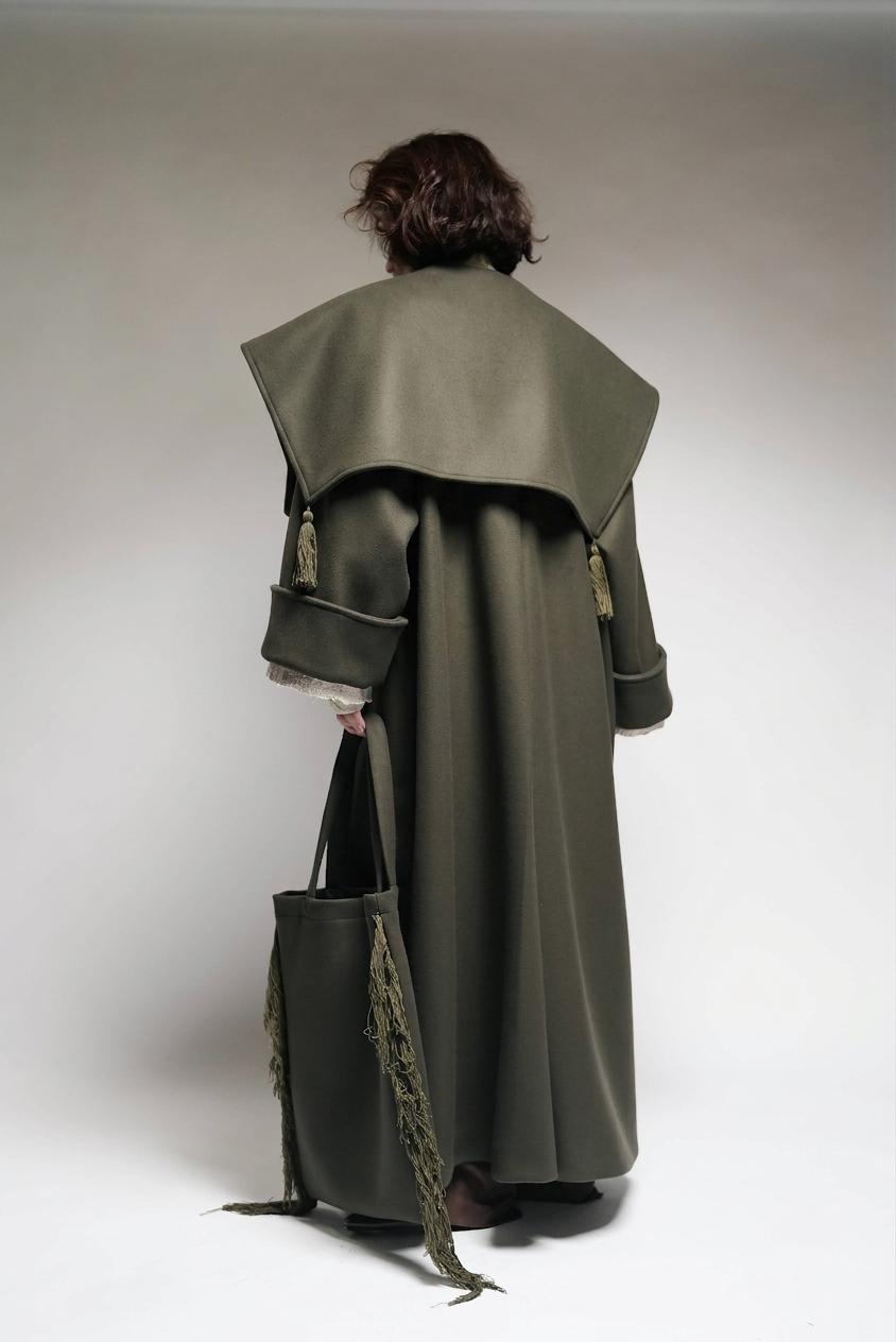 Between Worlds. The coat.